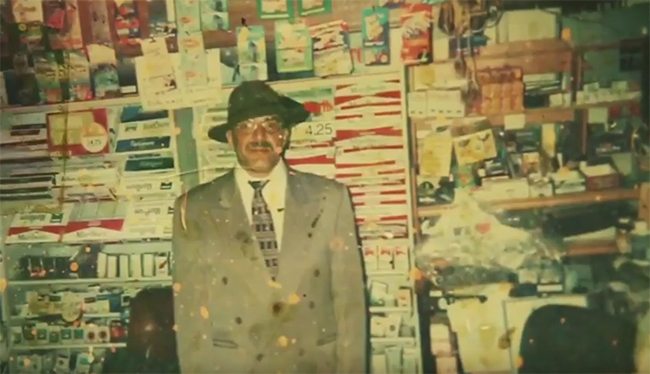 Philz story video clip screenshot - Phil standing in suit and hat