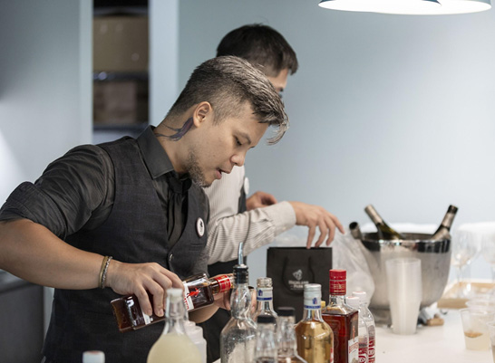 Bartender mixing drinks